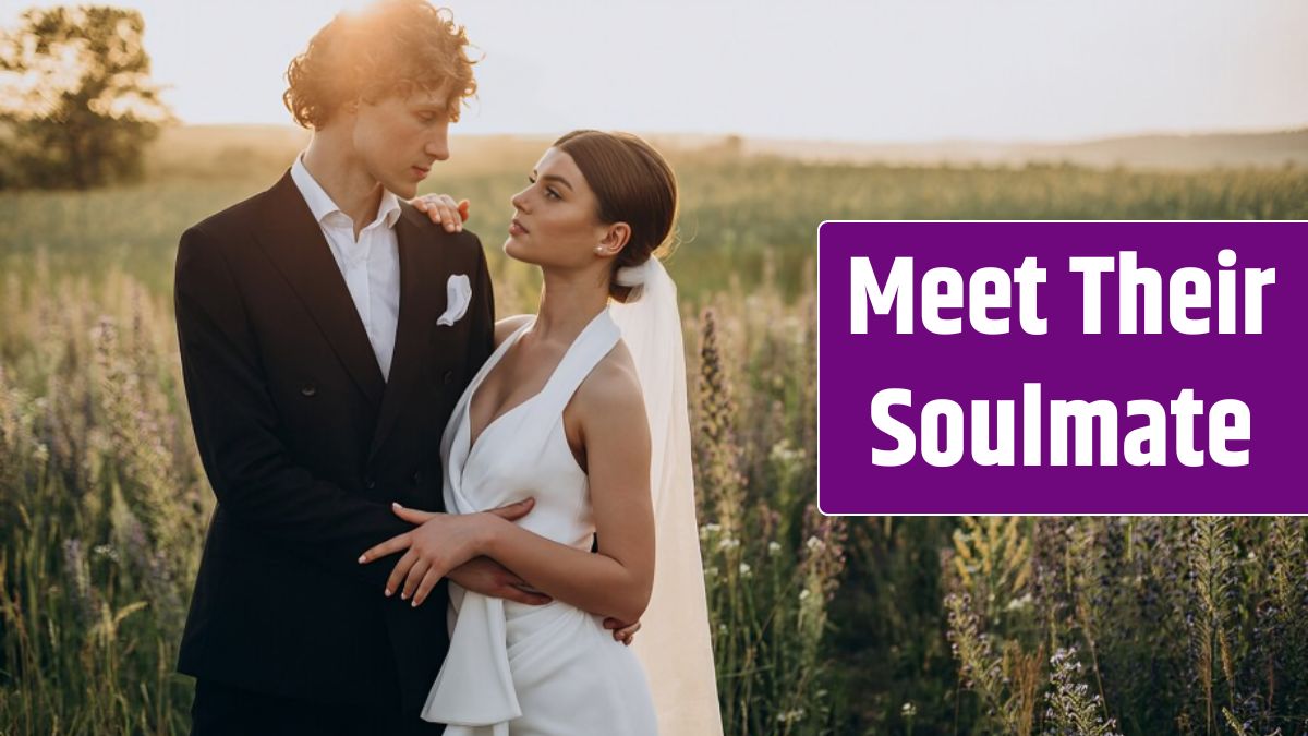 Young wedding couple together in field.