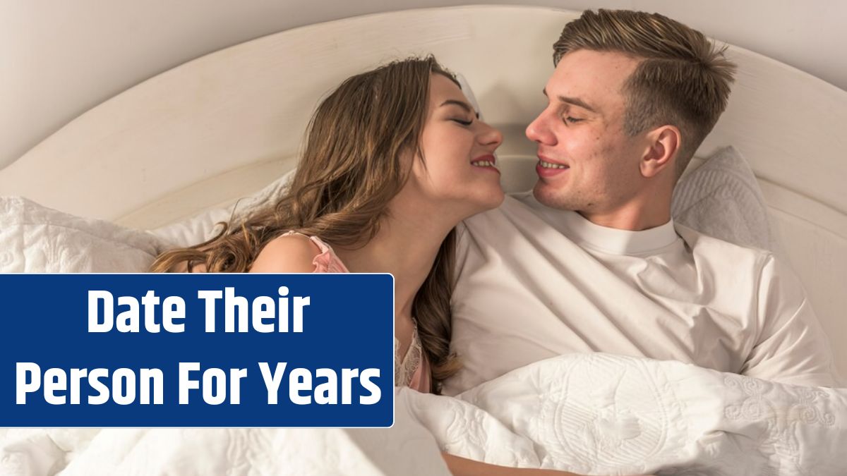 Young couple hugging in bed.