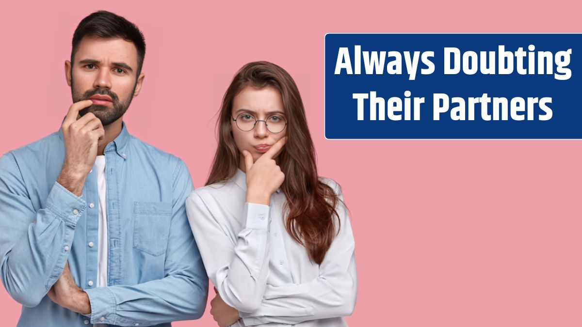 Young man and woman in shirts posing.