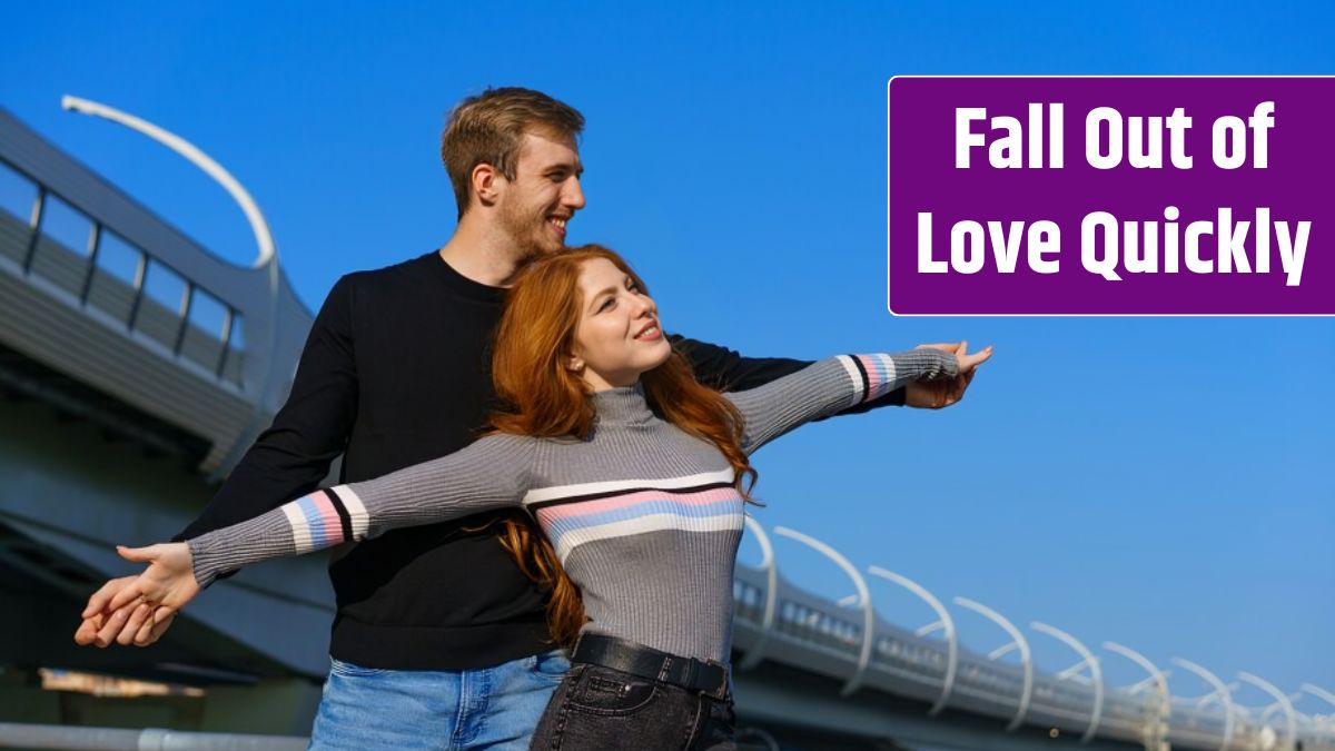 Happy young couple man and woman with long red hair stand against the background of a blue sky and a bridge in casual clothes.