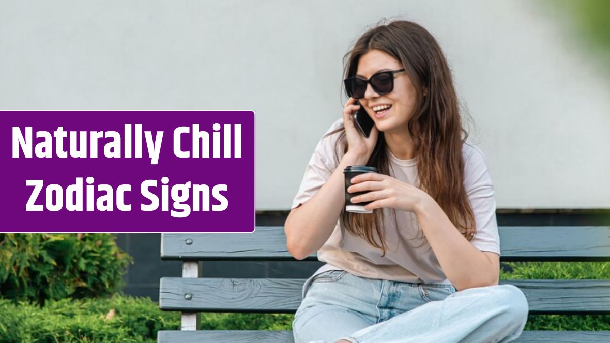 Business young woman sits on a bench and speaks on the phone.